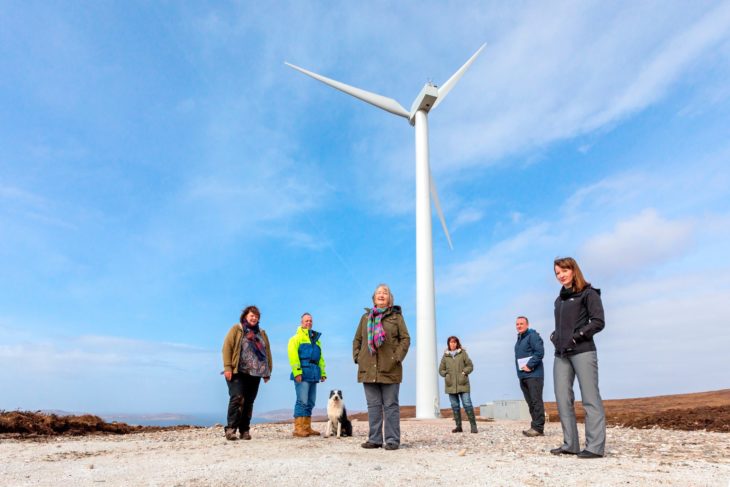 Members of Coigach Community Development Company at the opening of the community wind turbine.