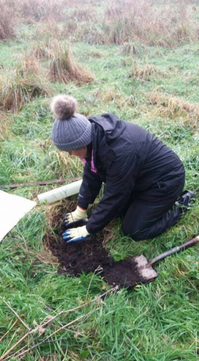 Christine McGovern planting a tree © Christine McGovern