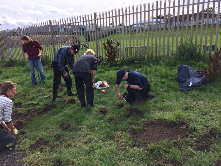 Volunteers planting a range of wildflowers at Seafield - the City of Edinburgh Council has stopped mowing this area of amenity grassland in partnership with the local community. © Leonie Alexander / RGBE 