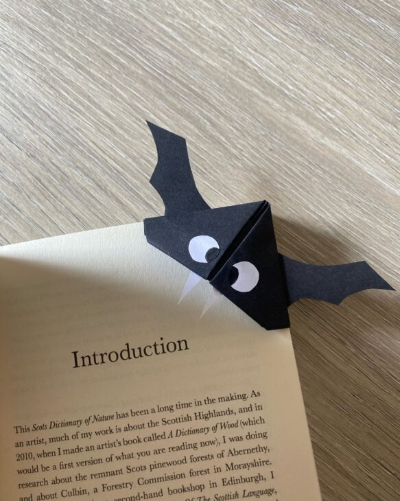 Finished bat bookmark on corner of book page