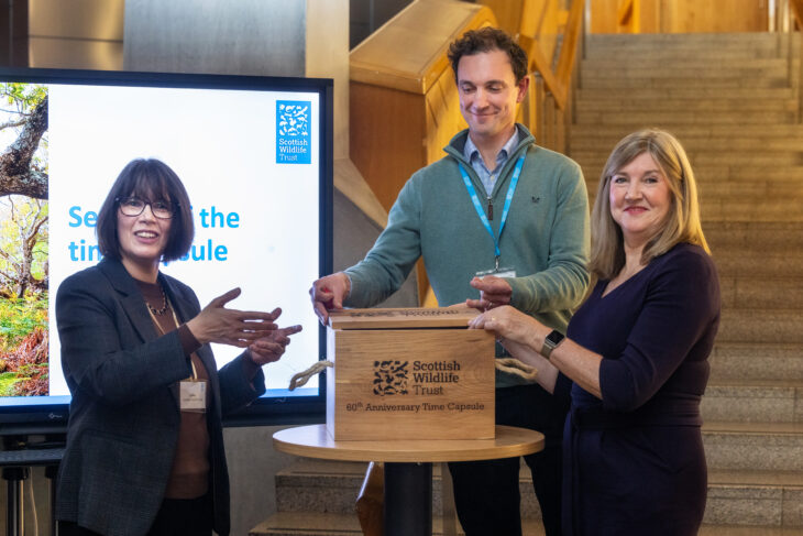 Scottish Wildlife Trust Chief Executive Jo Pike, Head of Communications & Engagement Pete Haskell, and the Scottish Parliament's Presiding Officer, Alison Johnstone MSP, seal the Trust's 60th anniversary time capsule - a small rectangular wooden box.