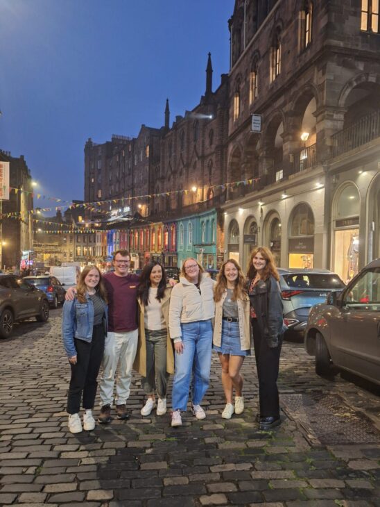 The Wildlife Trusts President, Liz Bonnin, alongside members of the Scottish Wildlife Trust Young Leaders on a busy street in Edinburgh.