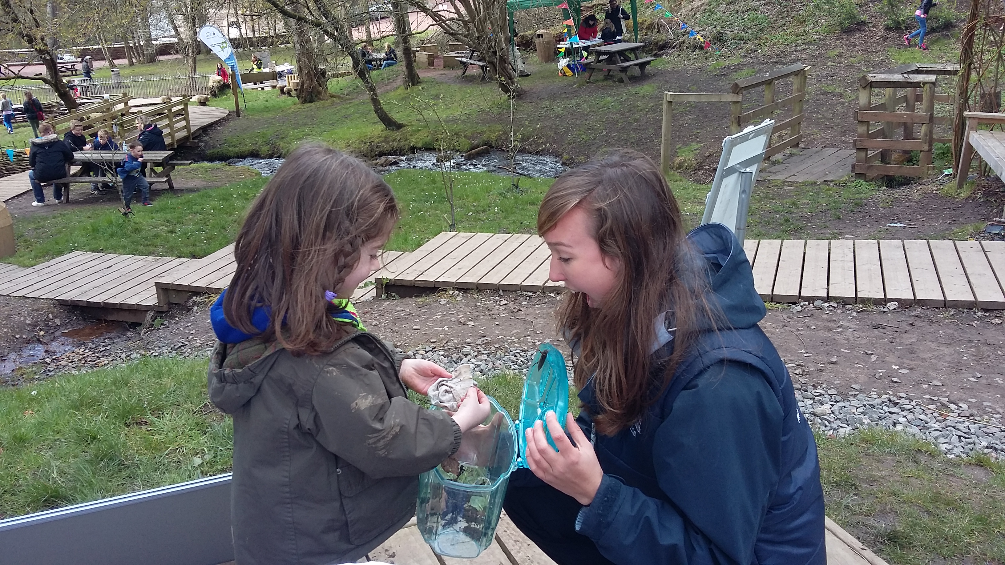 Lori Moore and visitor collecting minibeasts (c) Lori Moore